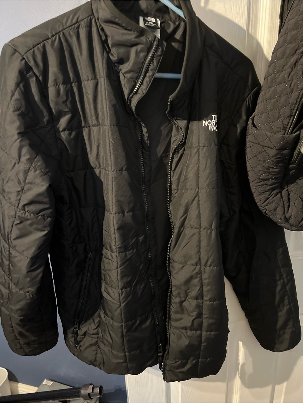 The North Face Black Jacket with white embroidered Tag Detail